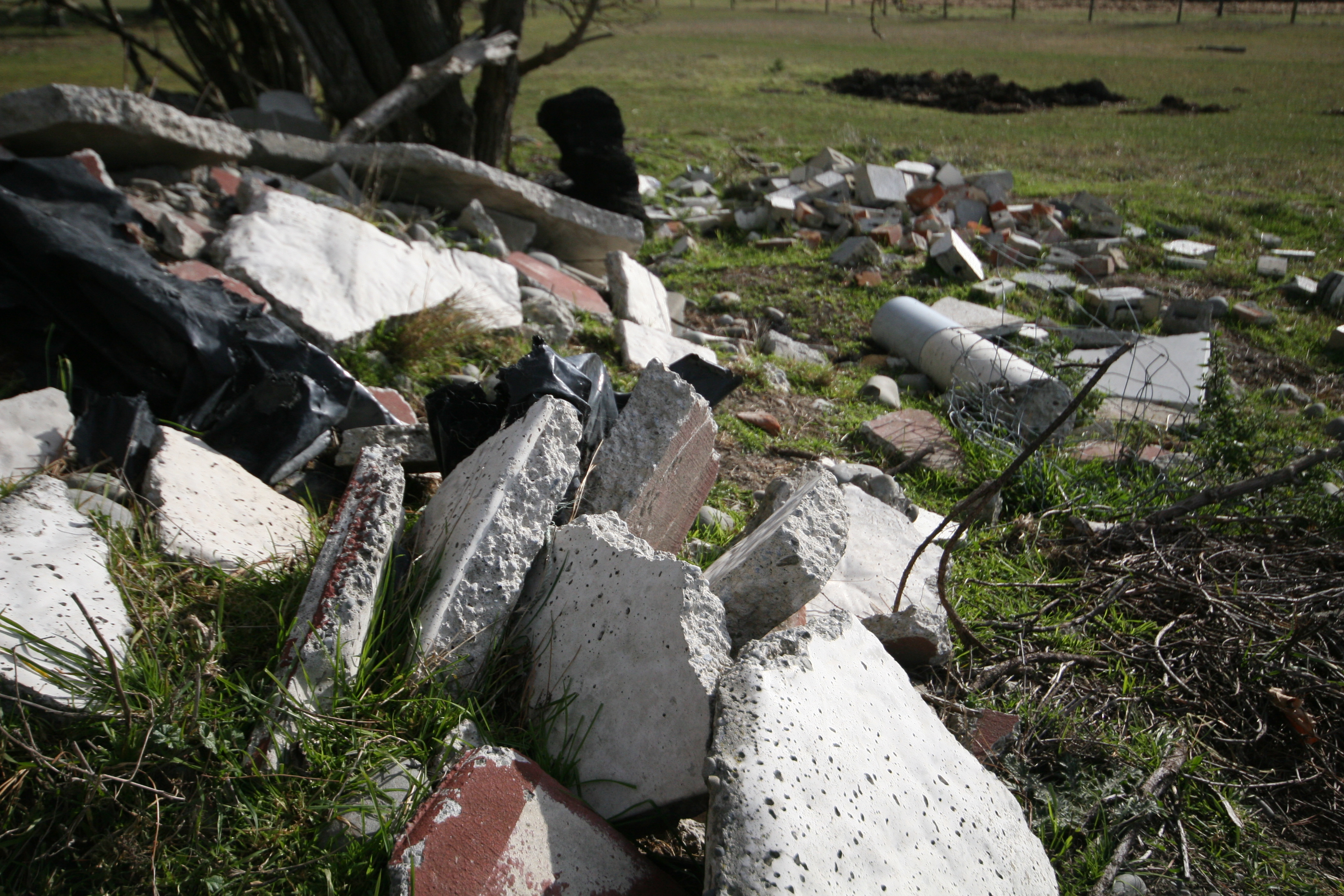 rubble dumped in a field