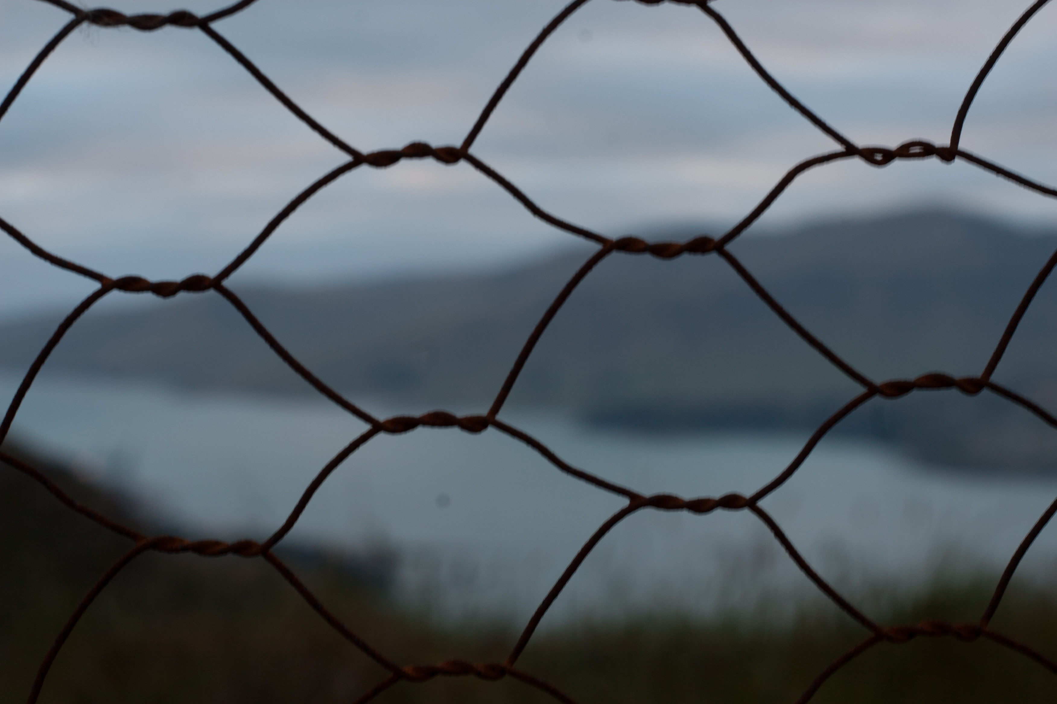 view of diamond harbor through a wire fence