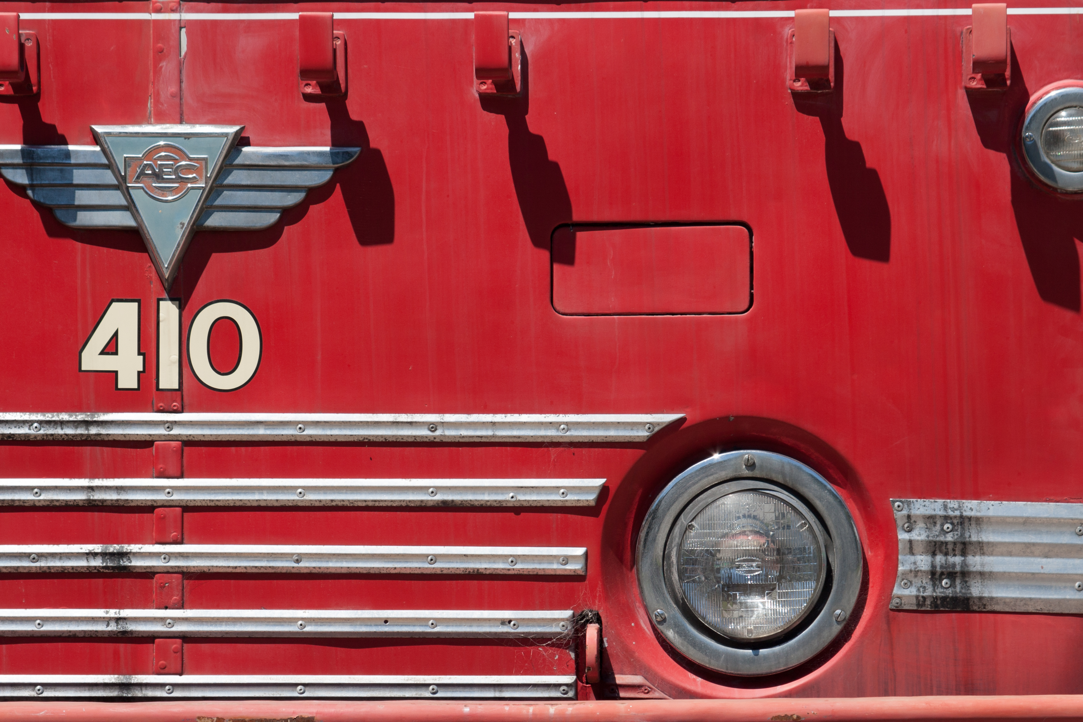 old vintage red bus pram holder