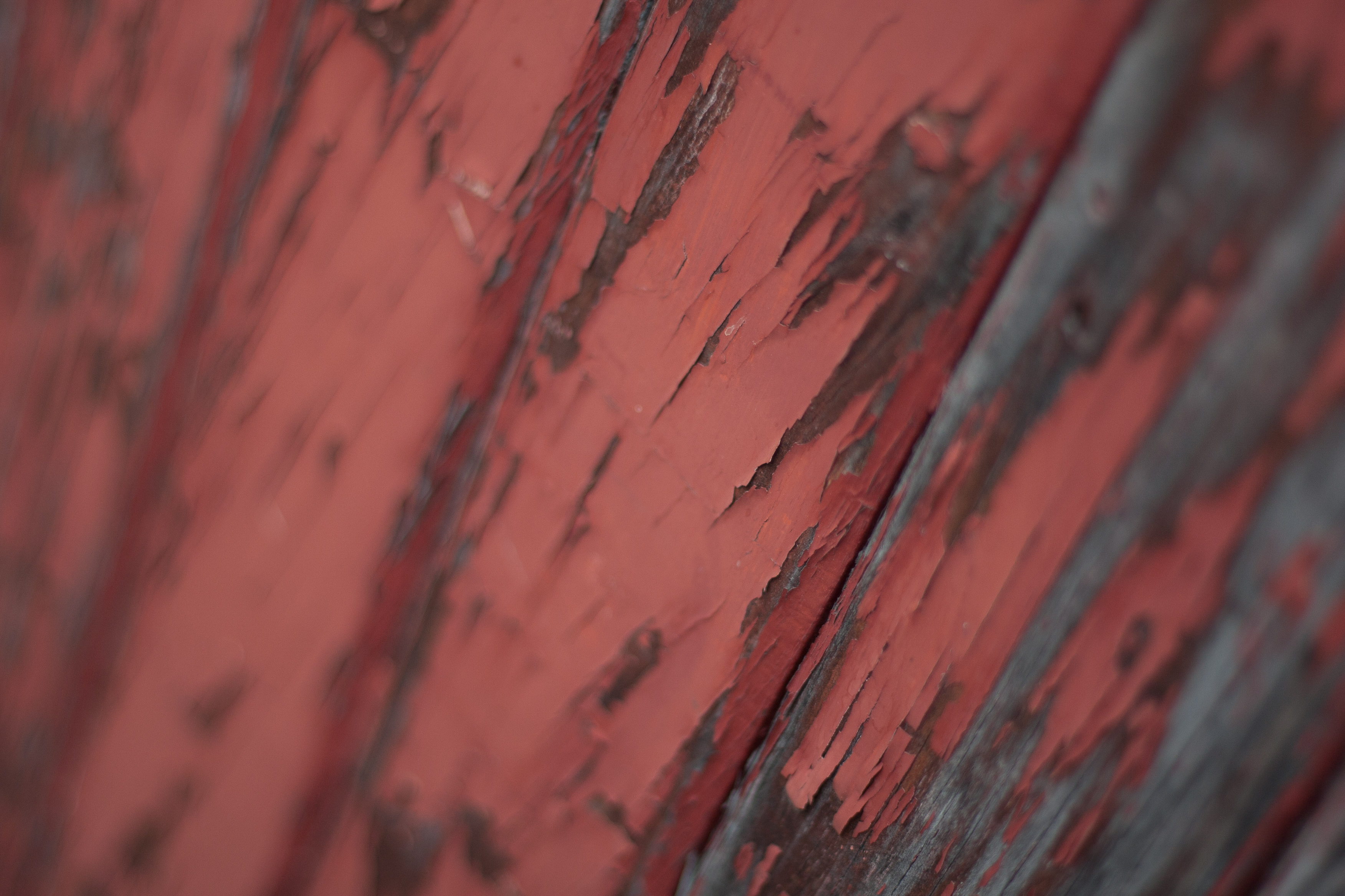 wooden slats with peeling red paint